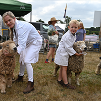 Lady and boy with sheep