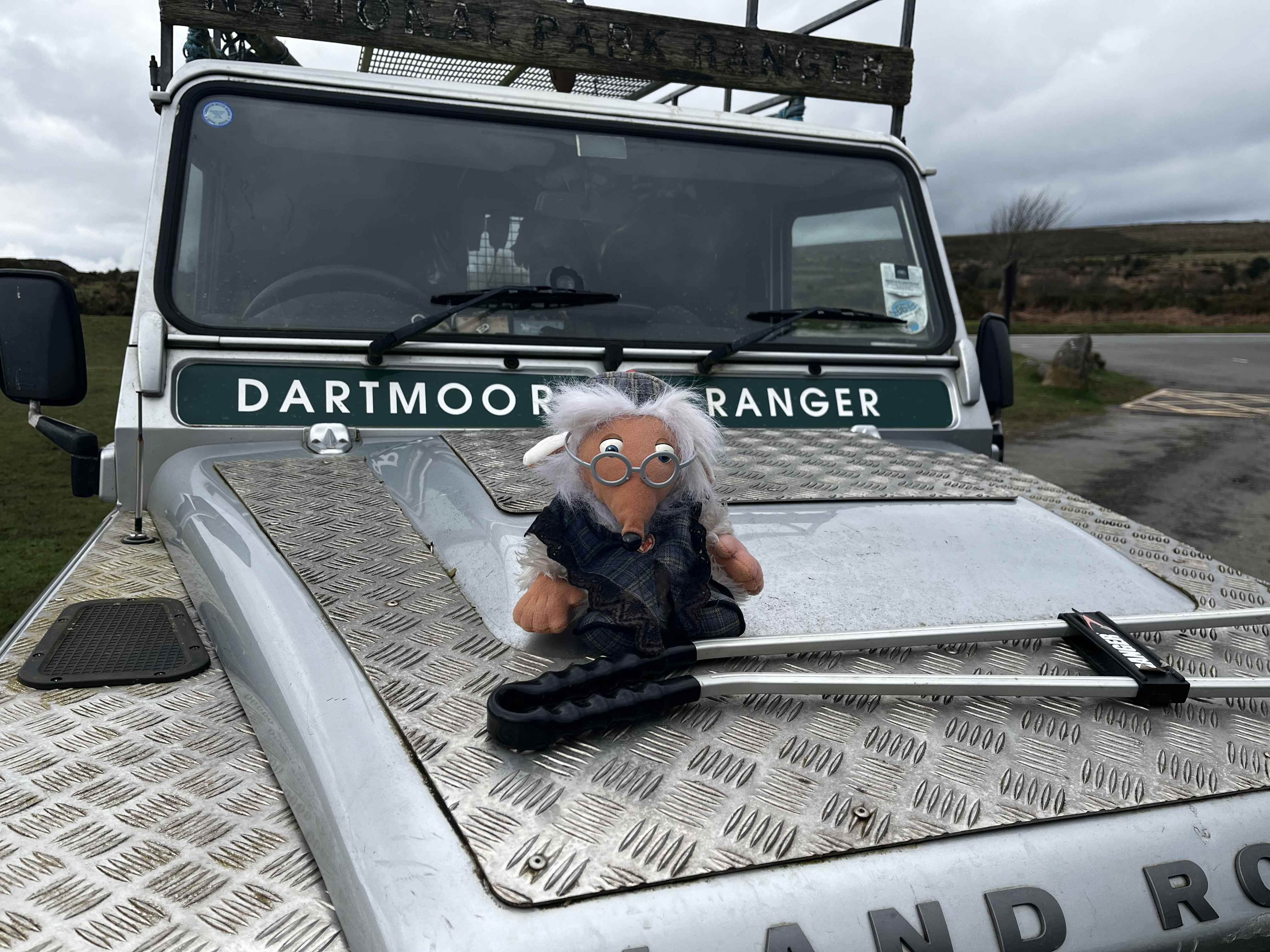 A toy of the Womble Great Uncle Bulgaria sits on top of a Dartmoor Ranger vehcile