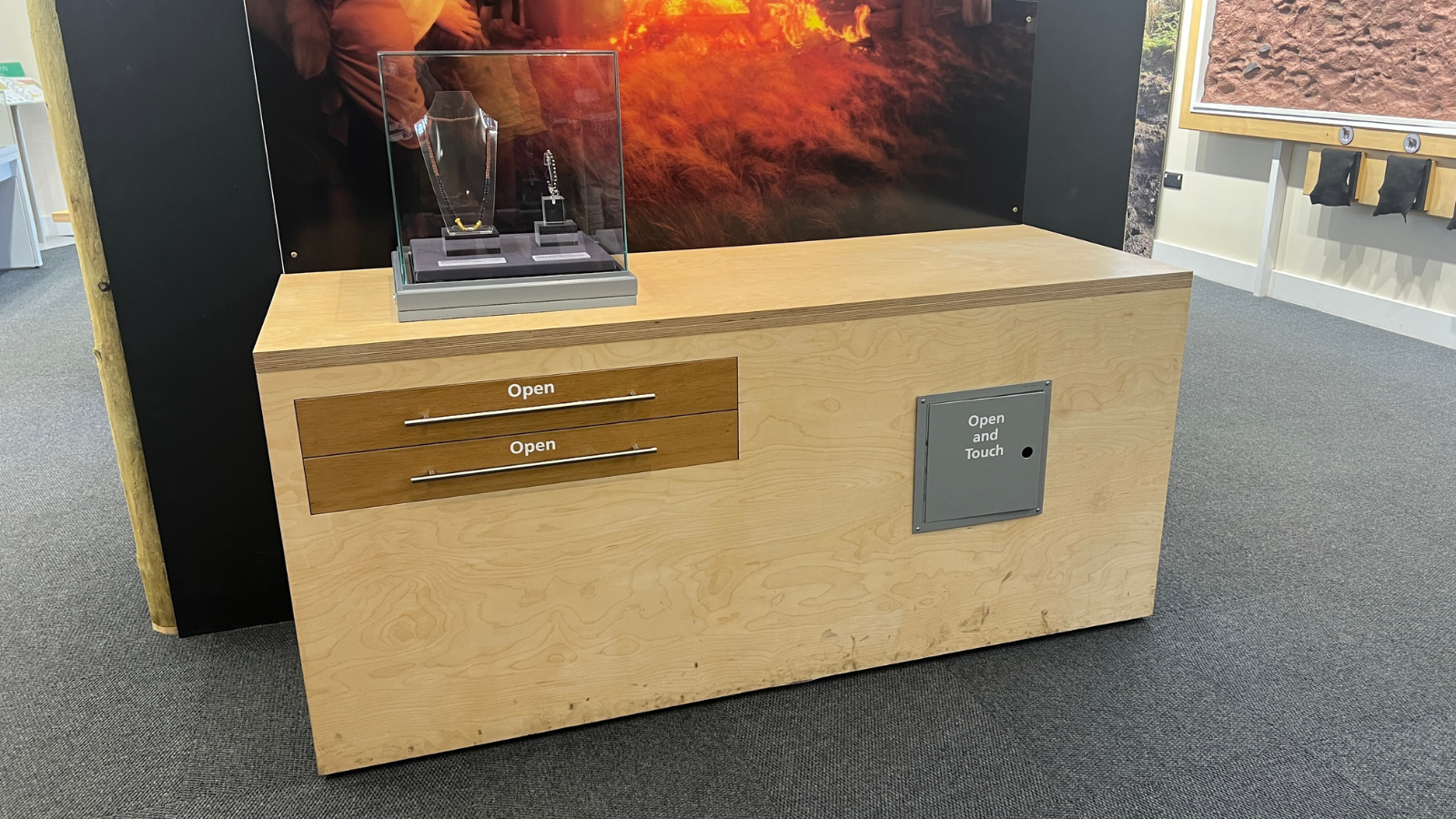 Displays showing open me and touch me at a low level 