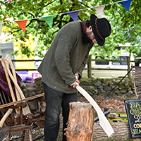 Man chops log