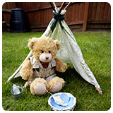 Teddy sat in a wigwam fishing