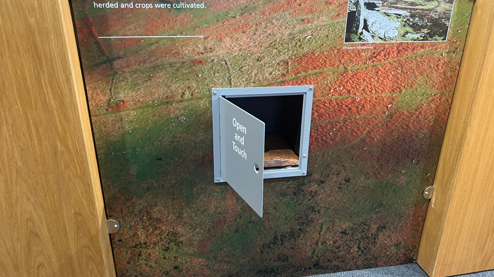 Door with open and touch on is open. Door is at a low leval