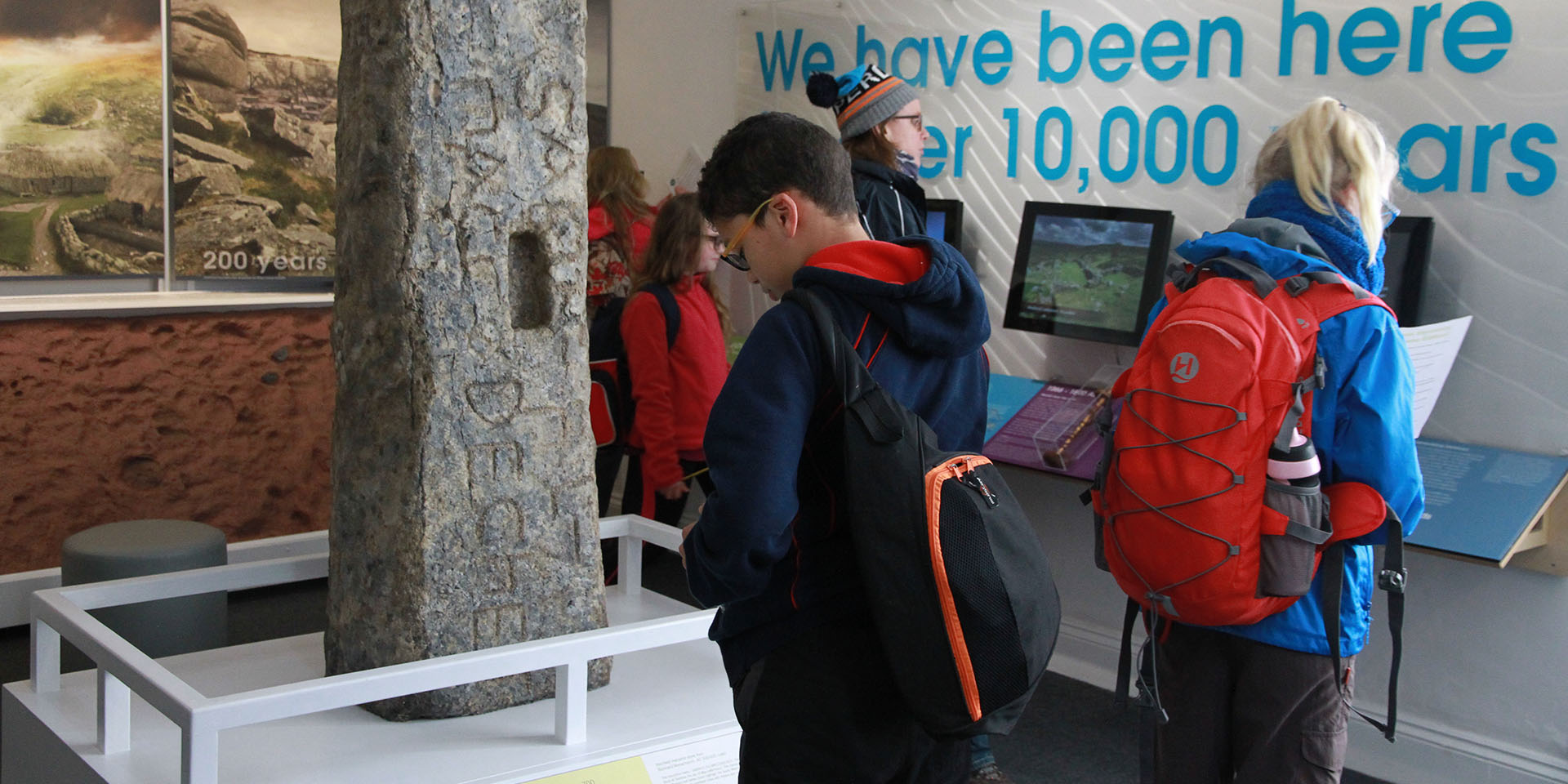 School child reading about Bronze Age artefact