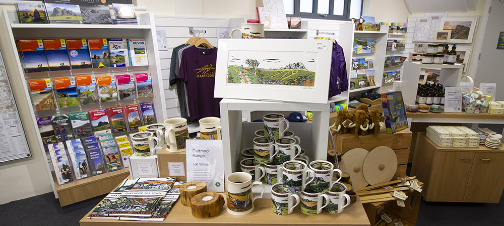 Dartmoor themed t-shirts, mugs, stuffed toys and other retail items on display