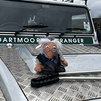 womble sat on hood of ranger vehicle