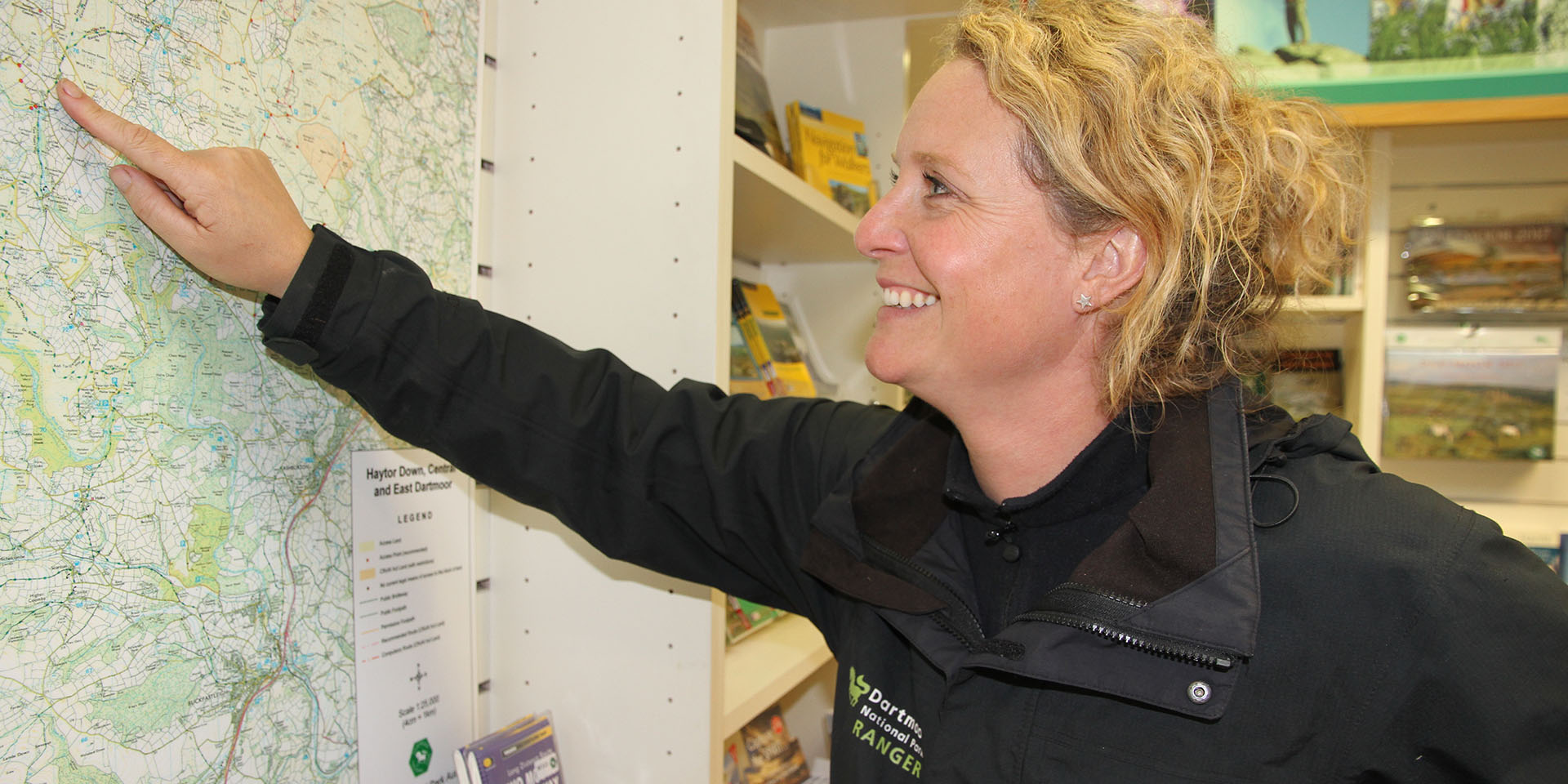 Ranger Ella looking at Haytor map