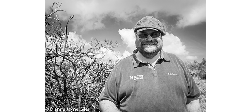 Ranger Bill Allen in front of gorse