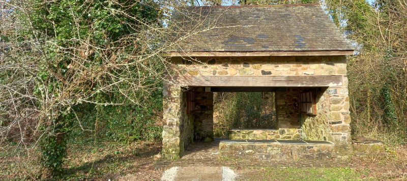 The old stone linty shelter in the sunshine. 