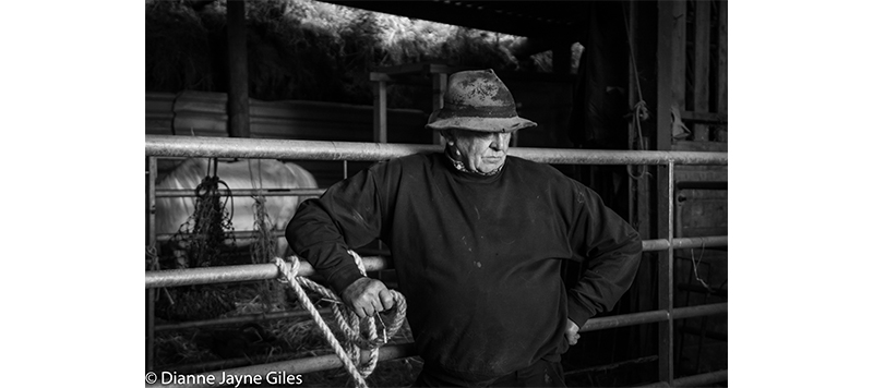 Farmer Mike in front of gate