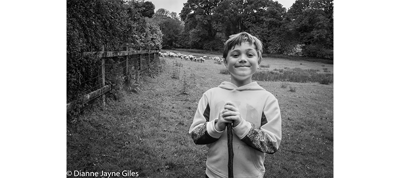 Boy standing in a field