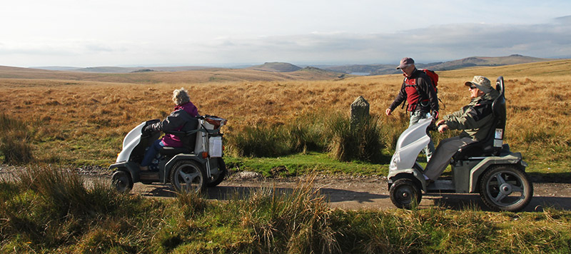 Two disabled ramblers using trampers on Nun's Cross path