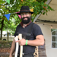 Man in hat smiling at camera