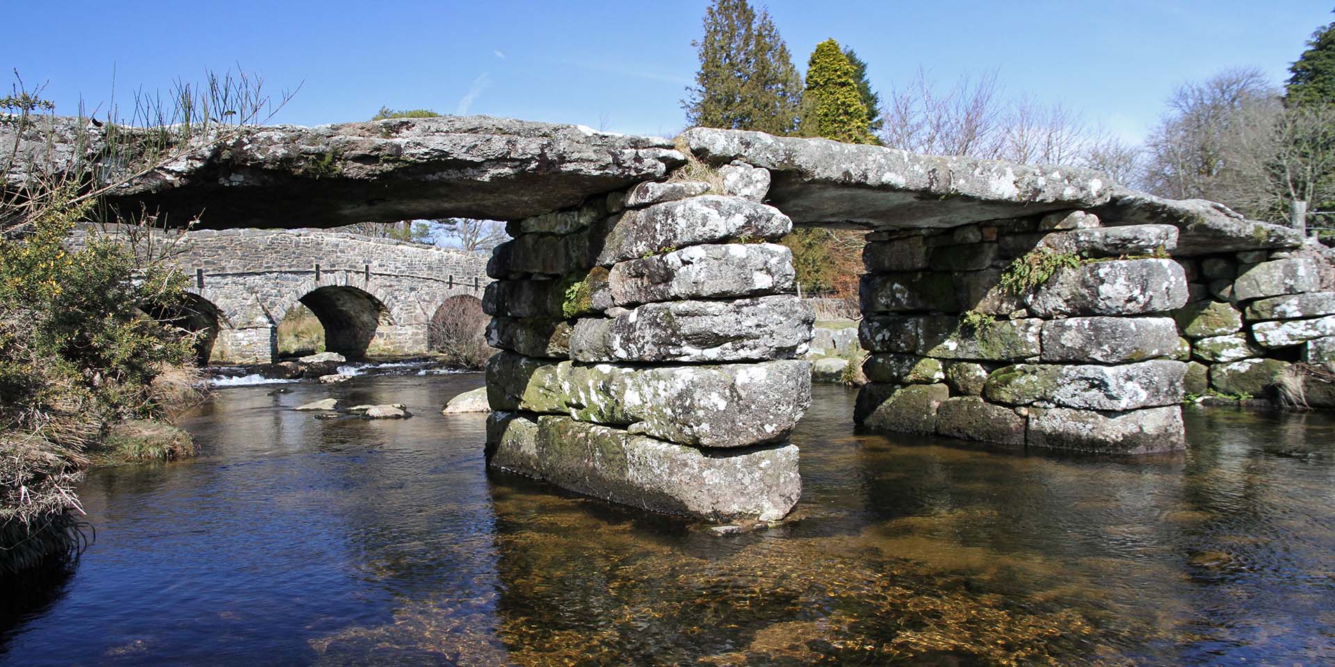 Postbridge clapper bridge and river