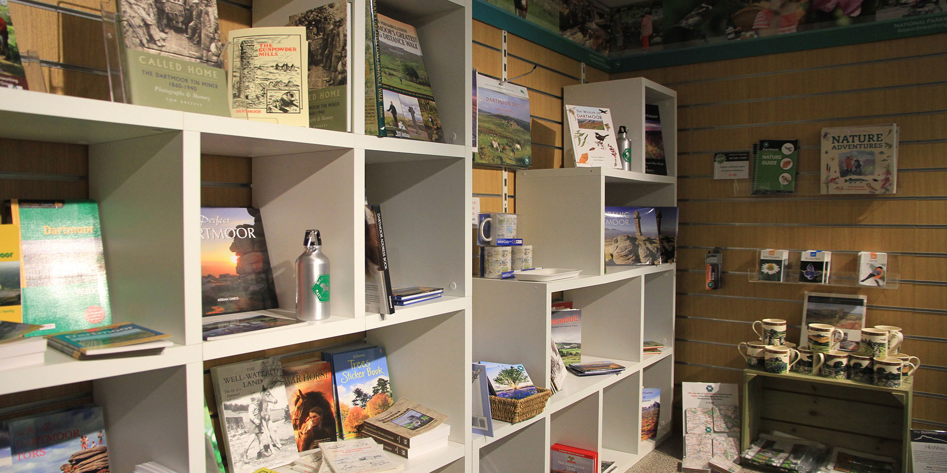 Merchandise and books on shelves in Postbridge Visitor Centre