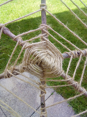 Spider web made out of string and twigs