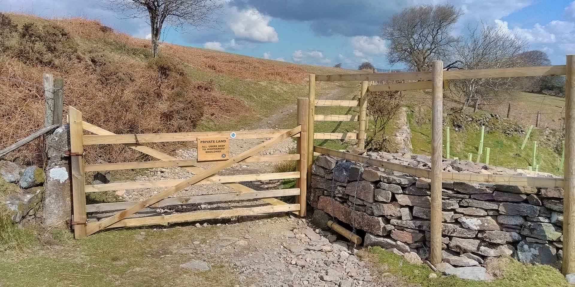 New gate and stone wall