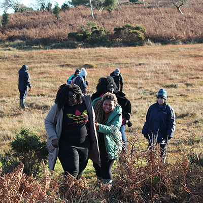 Group of people walking out of the bog.