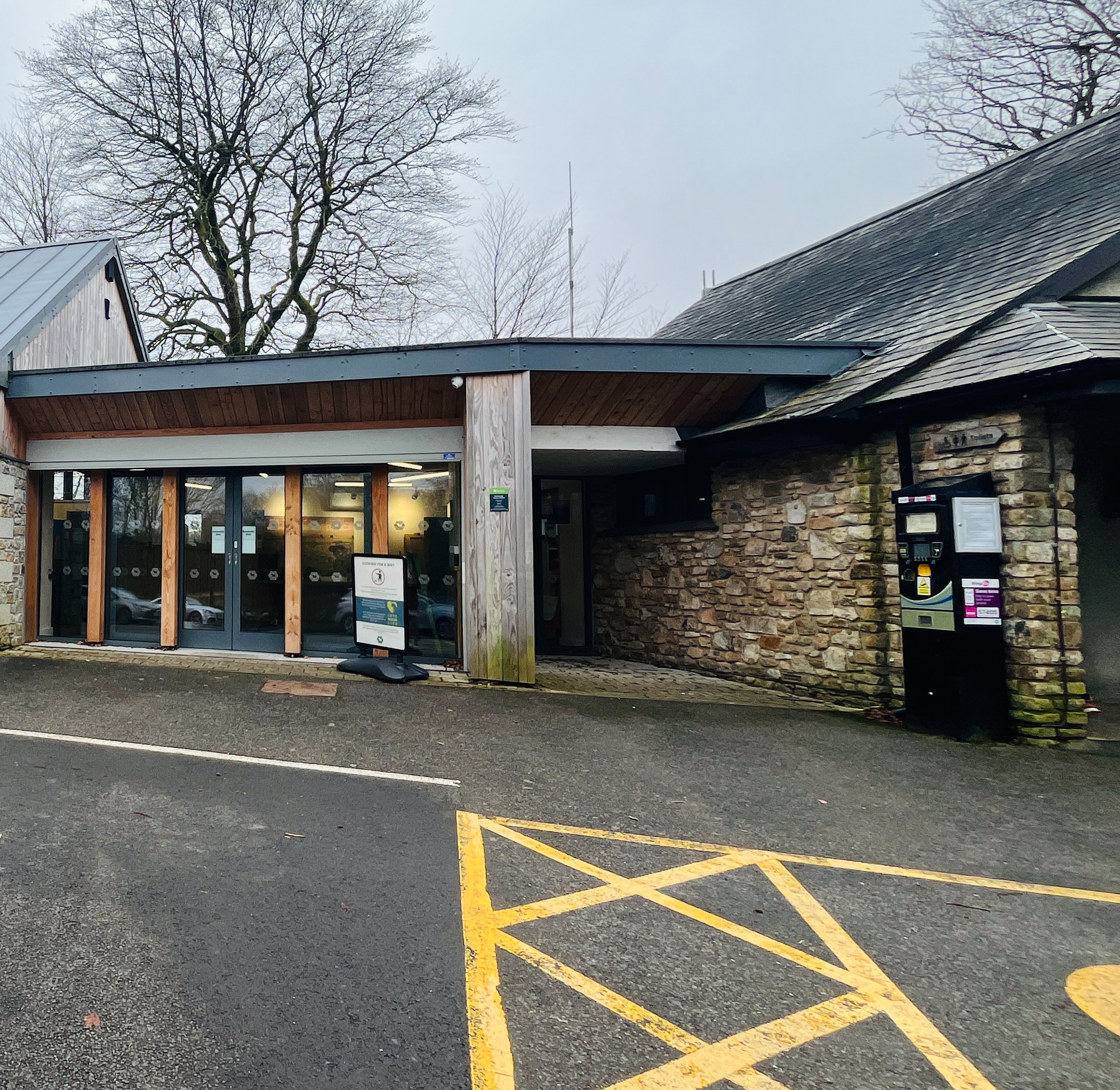 Close up of postbridge parking machine next to the entrance of the visitor centre