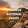 National Parks Fortnight Sunset over a tor with the text Discover National Parks